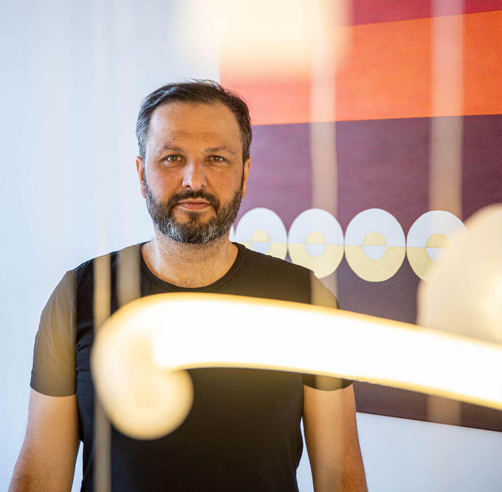 Designer Filip Houdek with his painting