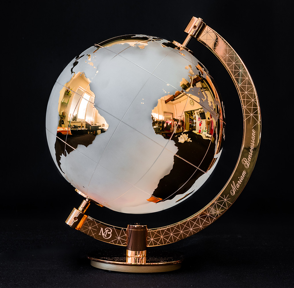 Golden globe with engravings